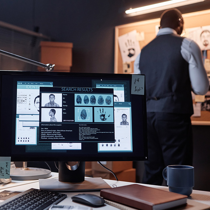 Computer with case file on screen in detectives office